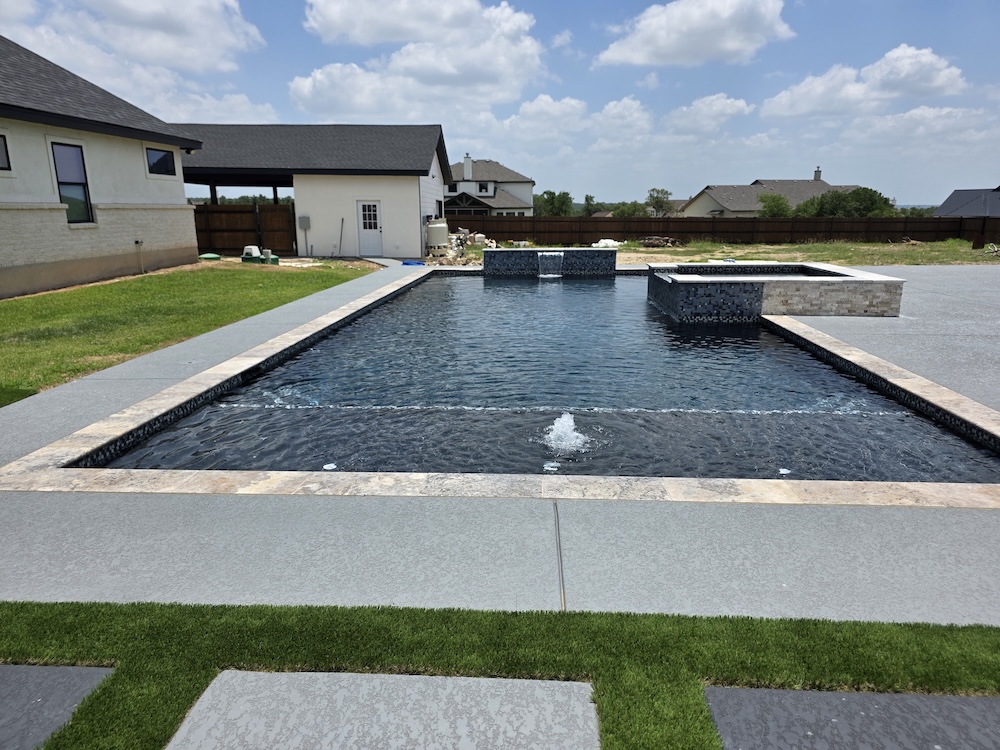 Dark modern pool with waterfalls