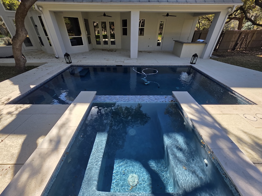 Elegant estate pool under oak trees